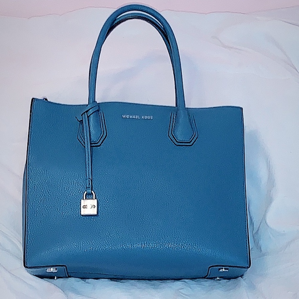 A baby blue Michael Kors bag